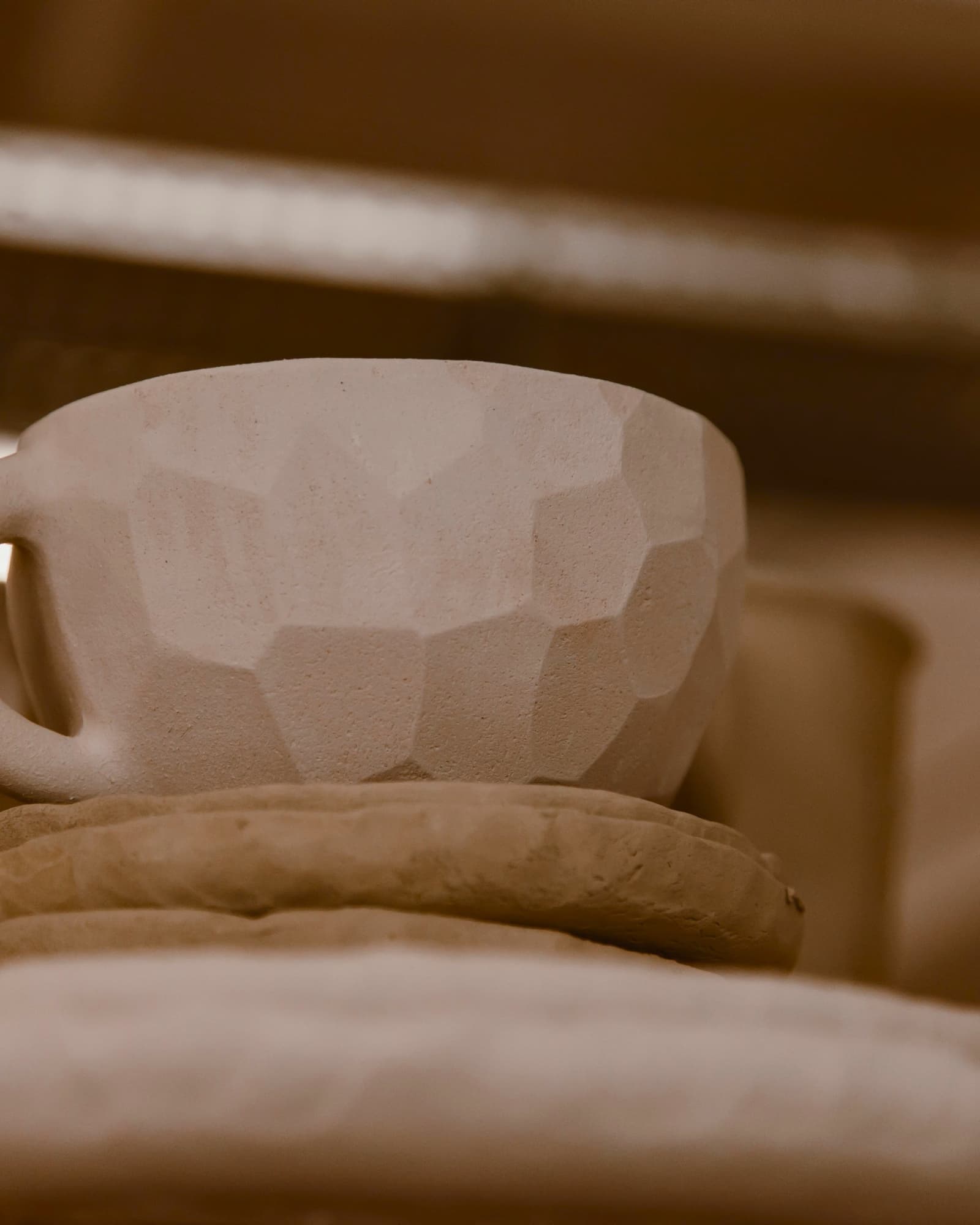 A ceramic piece formed by Bailey, showing the material, surface, and handmade form.