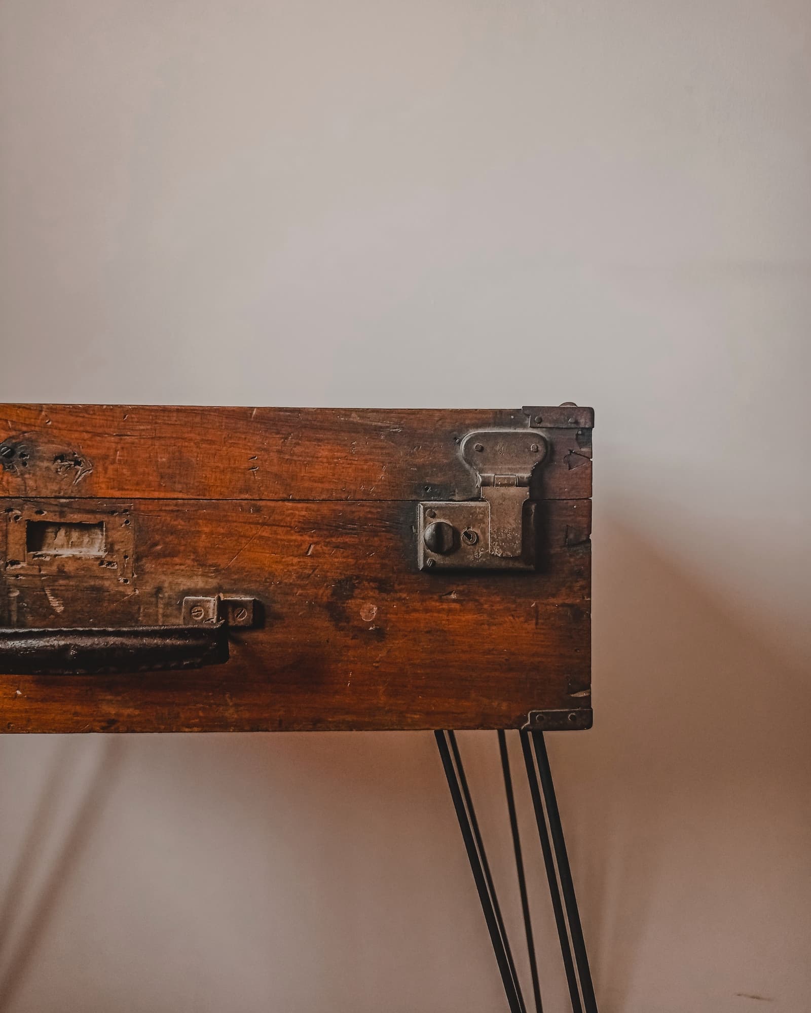 A reworked piece of furniture photographed at an angle, showing its transformed finish and form.